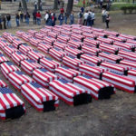 caskets draped in US flags